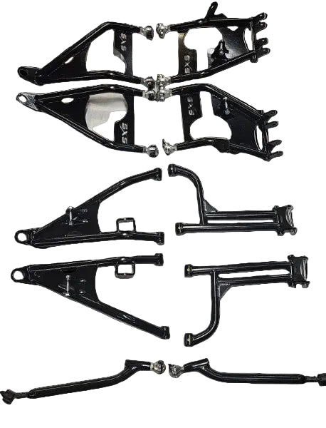 A set of black metal suspension and control arm parts laid out on a white sheet of paper, with some silver hardware visible